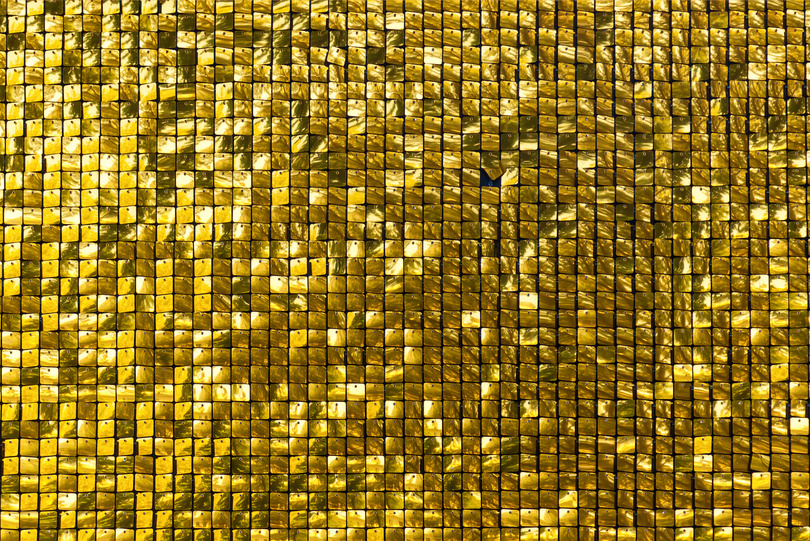 The modern abstract background with gold sequins